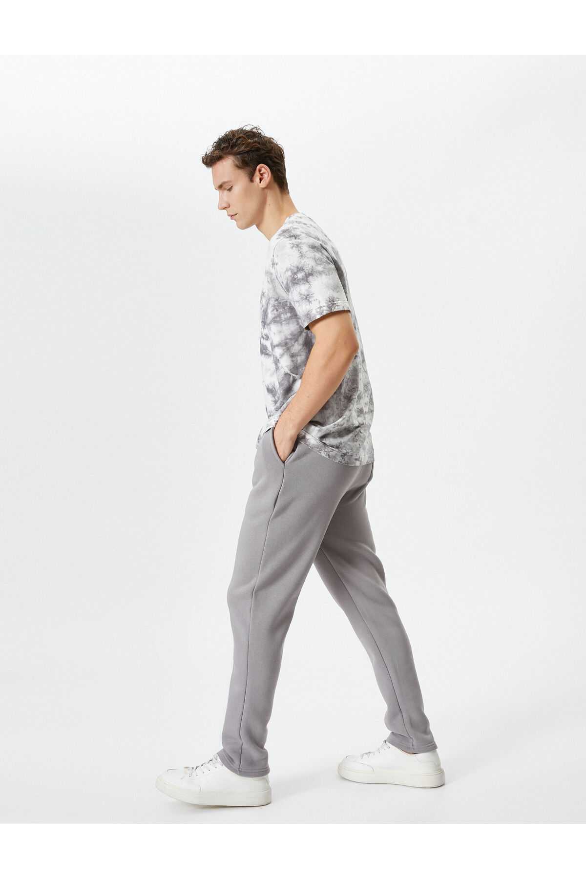 شلوار ورزشی پایه با جزئیات جیب و کمر بسته