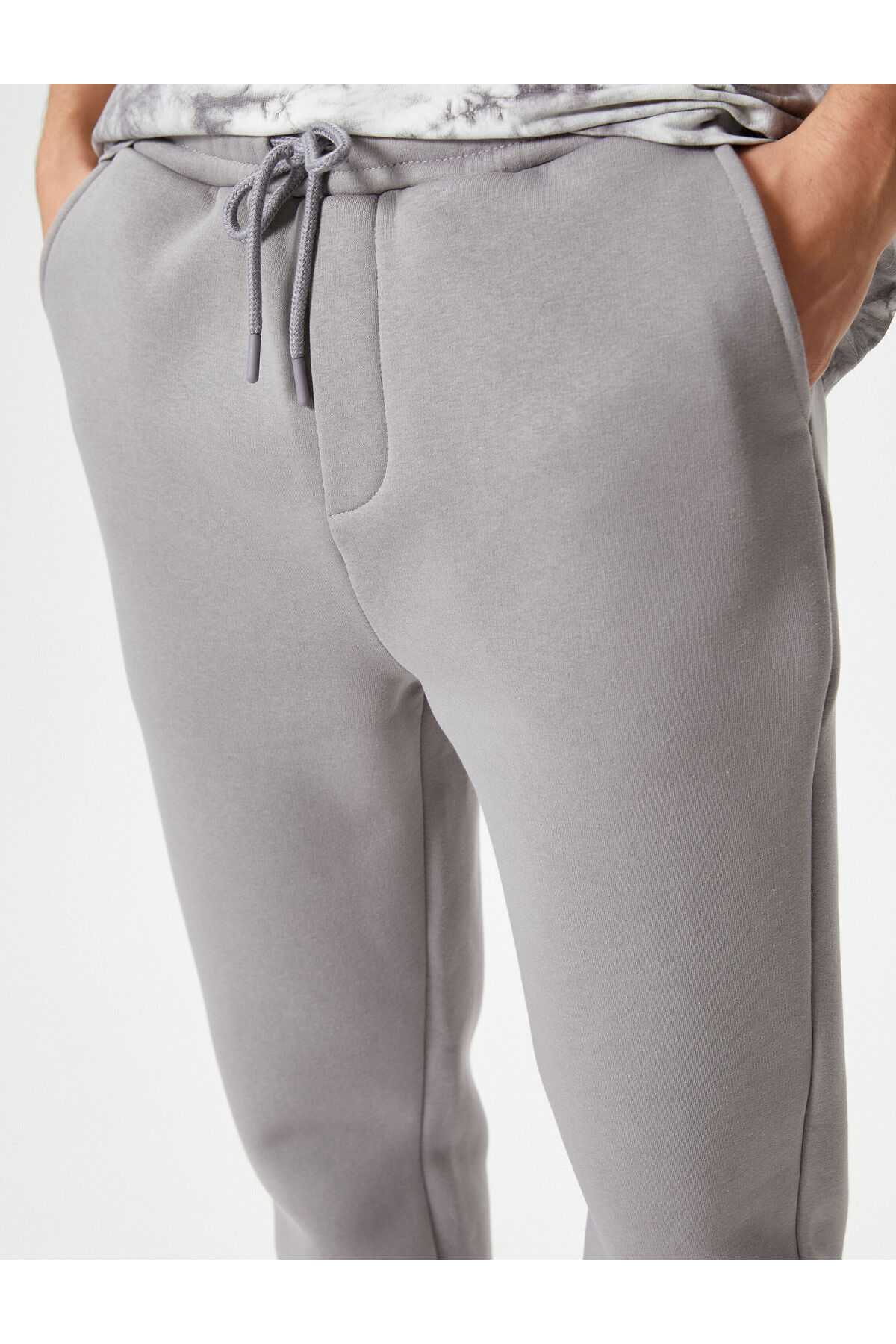 شلوار ورزشی پایه با جزئیات جیب و کمر بسته