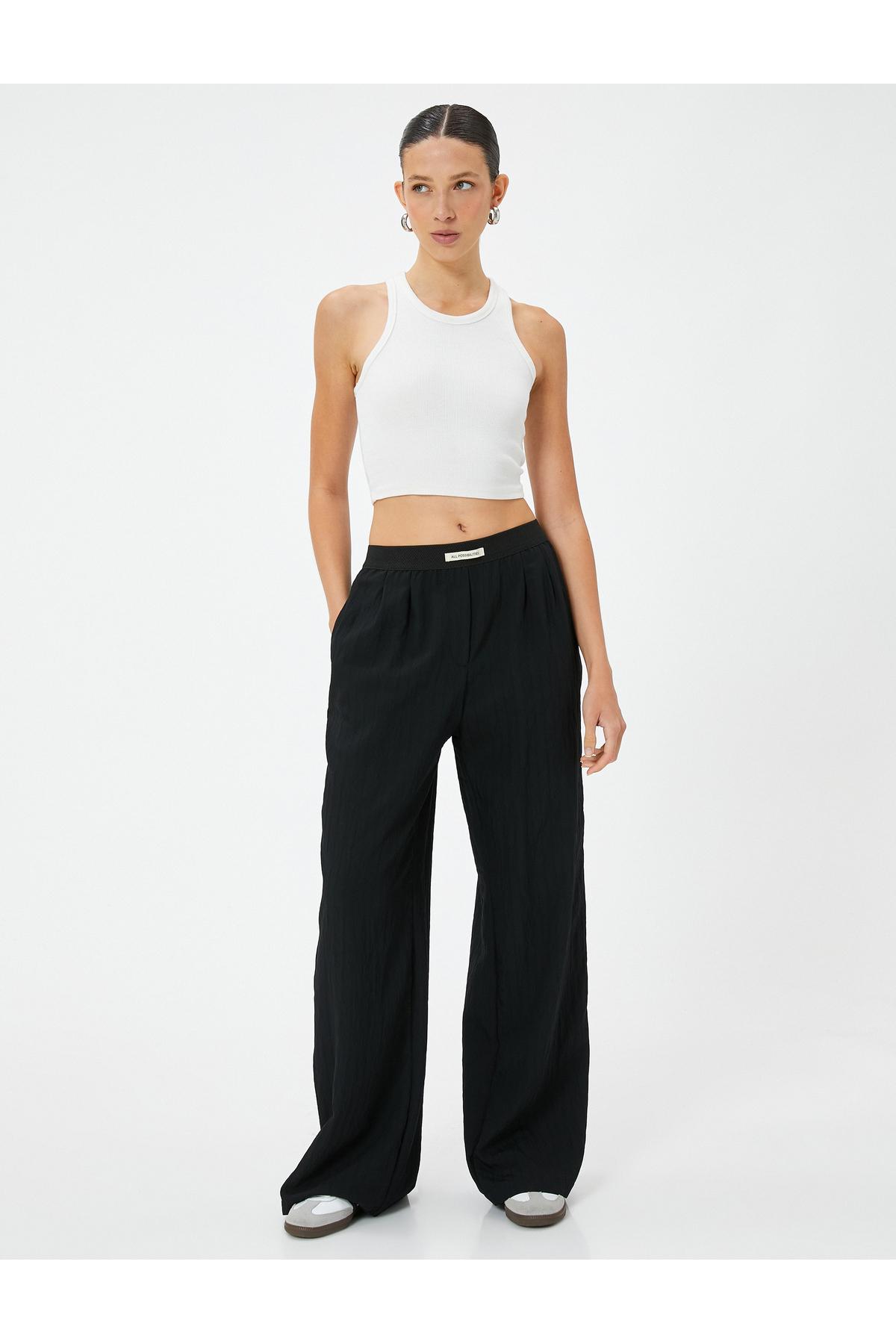 شلوار گشاد پارچه ویسکوز با بند الاستیک جزئیات کمر و جیب