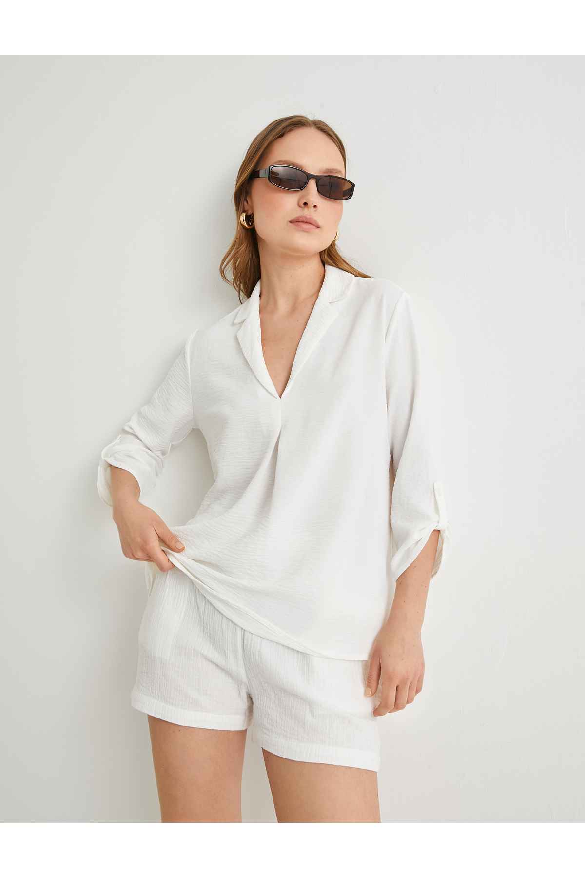 بلوز V یقه نیم آستین برش استاندارد بافت