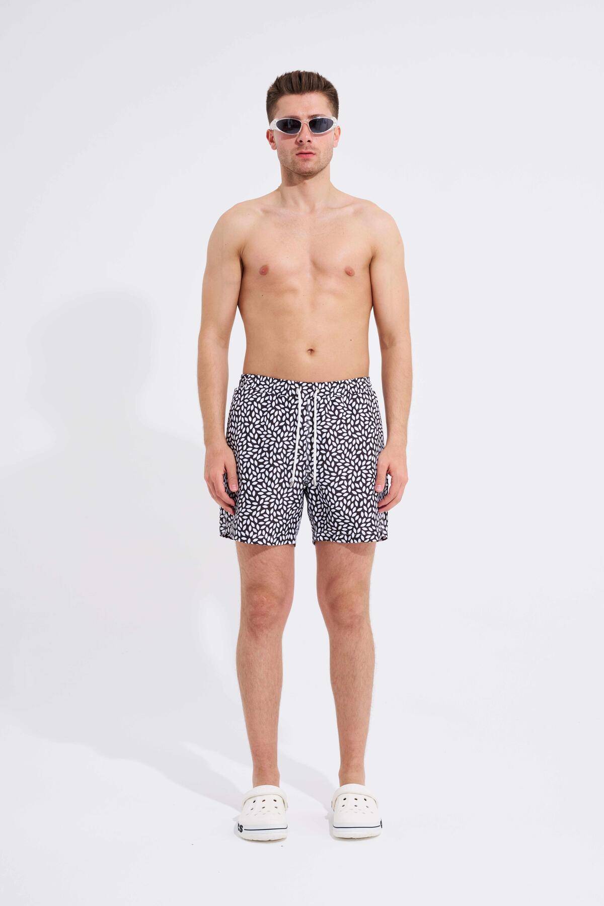 شلوار شنای سیاه و سفید چاپ برگ مردانه