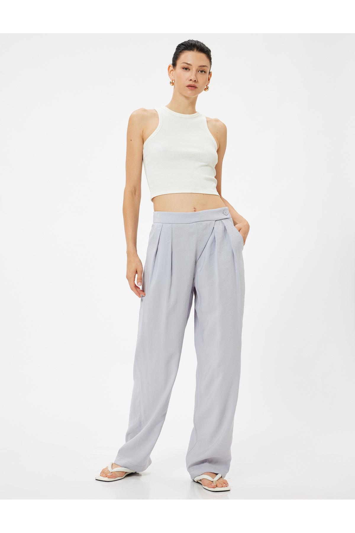 شلوار پارچه ای گشاد مدال با جیب و جزئیات پلیسه