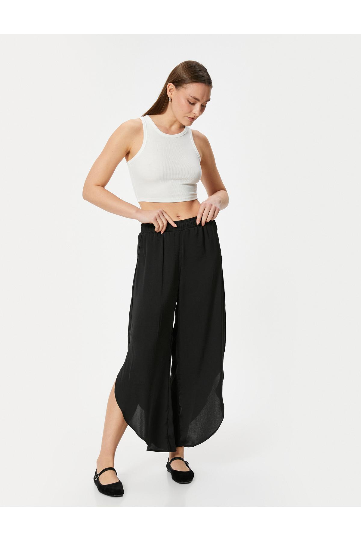 شلوار با شکاف نامتقارن و مناسب پارچه آئروبین