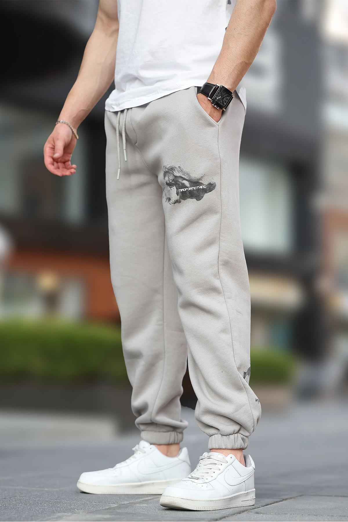 شلوار ورزشی جیبی الاستیک مردانه بژ با چاپ جزئیات