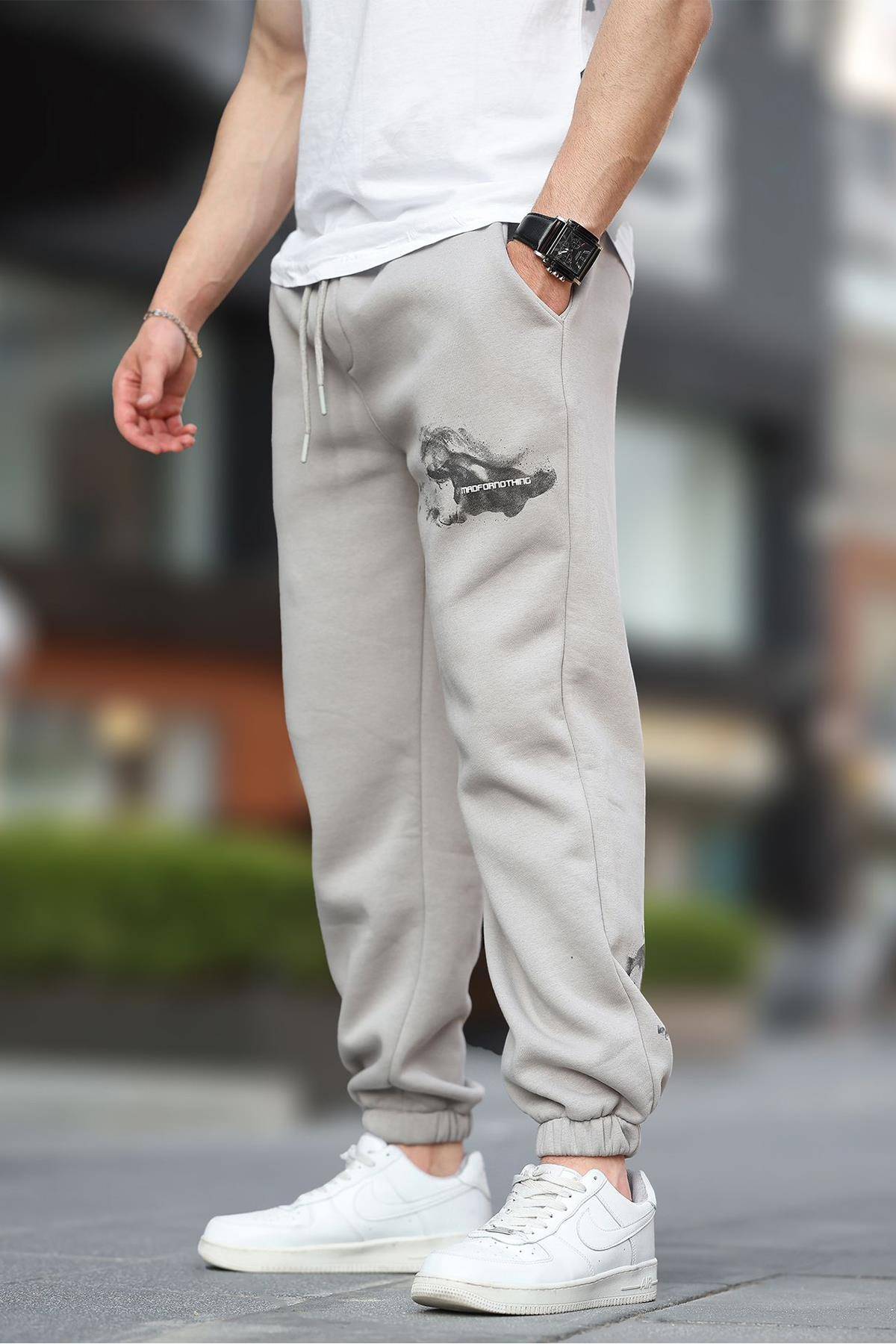 شلوار ورزشی جیبی الاستیک مردانه بژ با چاپ جزئیات