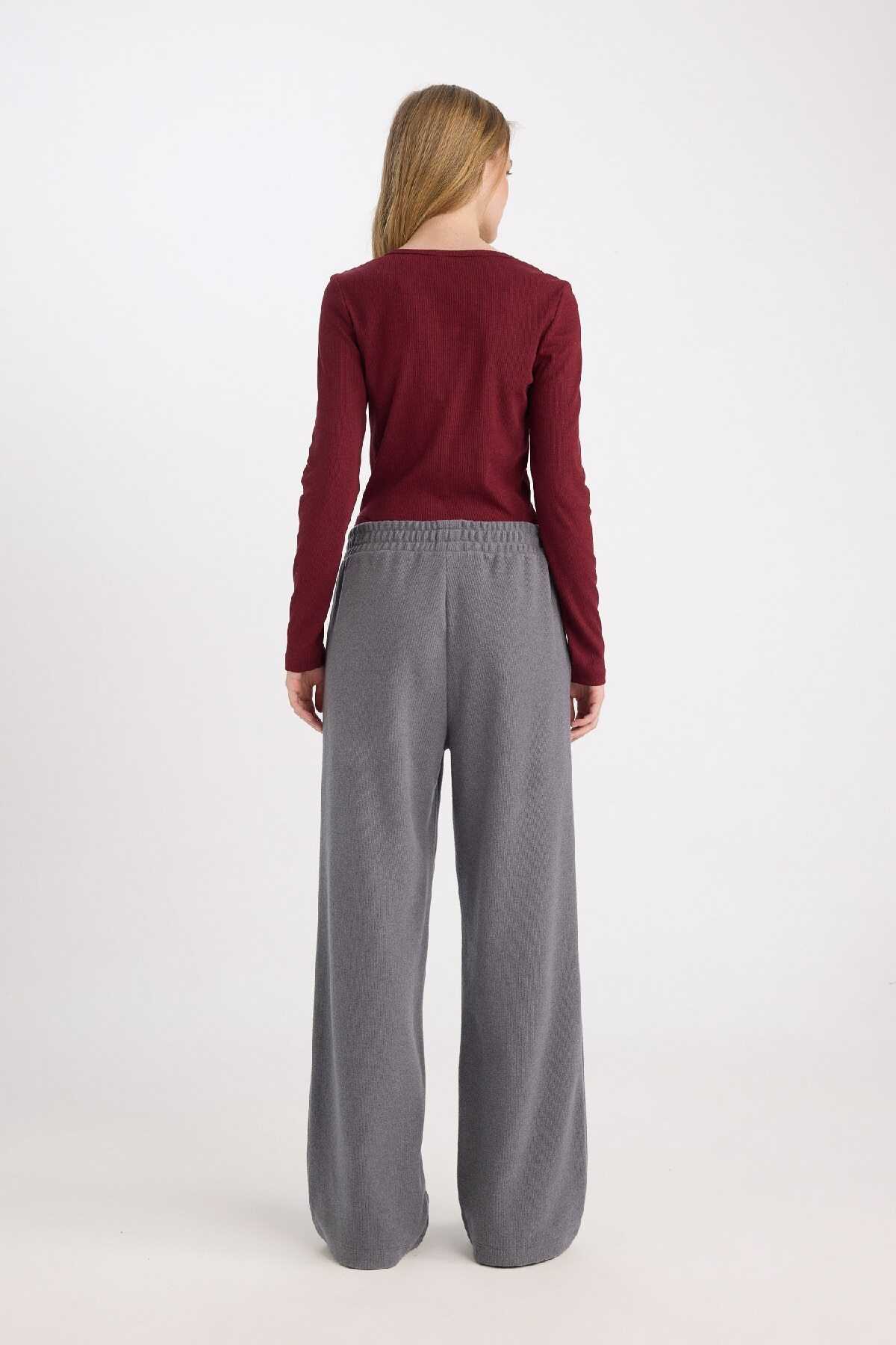 شلوار ورزشی بند دار بلند ساق پا گشاد