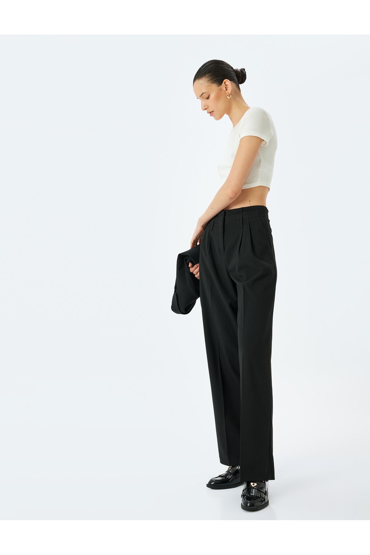 شلوار پارچه ای راست و گشاد با جیب